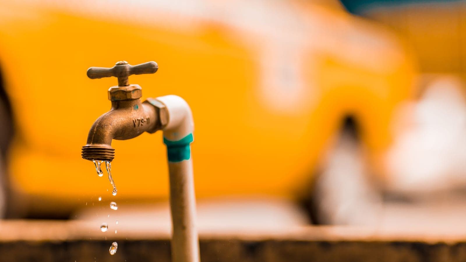 Water dripping from an outdoor pipe