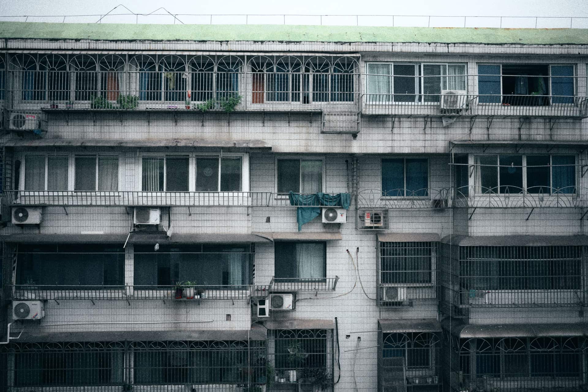 Air conditioning units on the facade of a multi-story apartment building