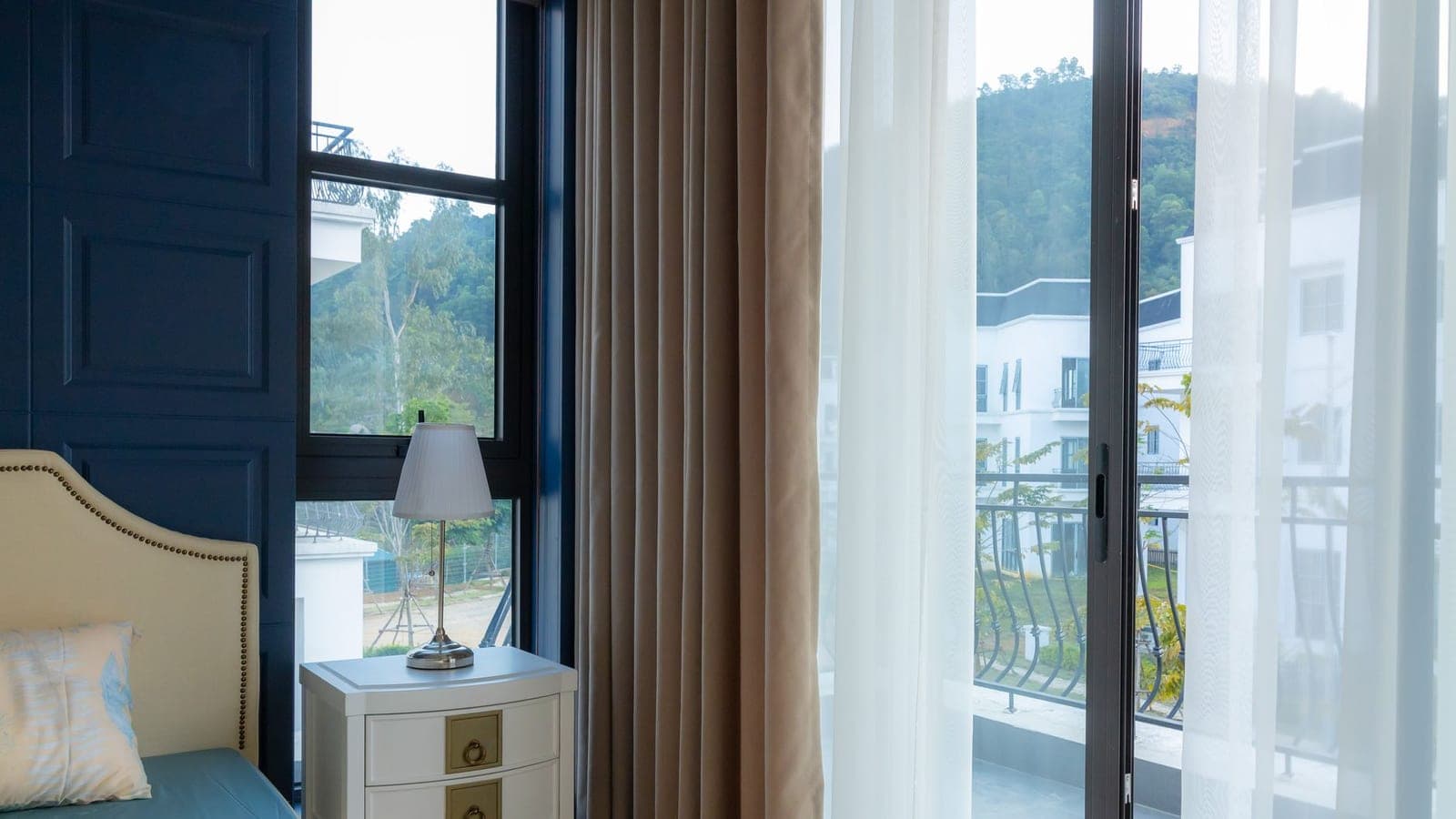 An apartment bedroom window in daylight