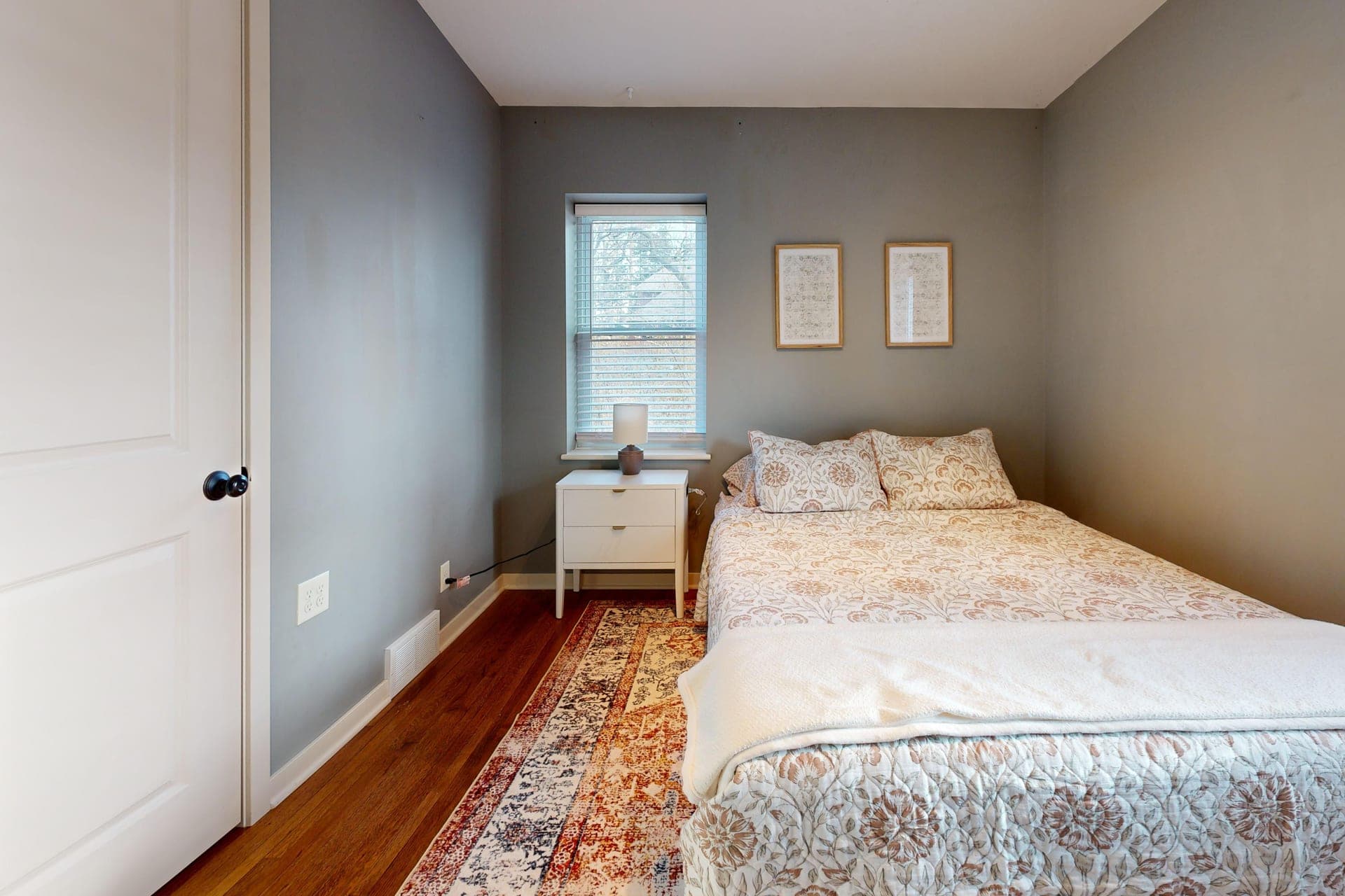 A minimalist bedroom with natural light from a window