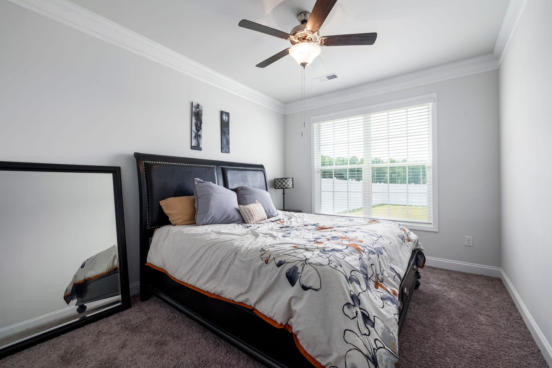 A bright modern bedroom with natural light through large windows