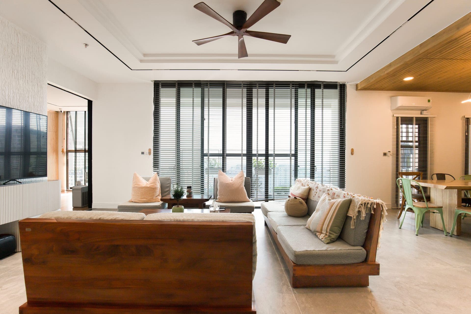 A stylish living room with large windows and modern decor