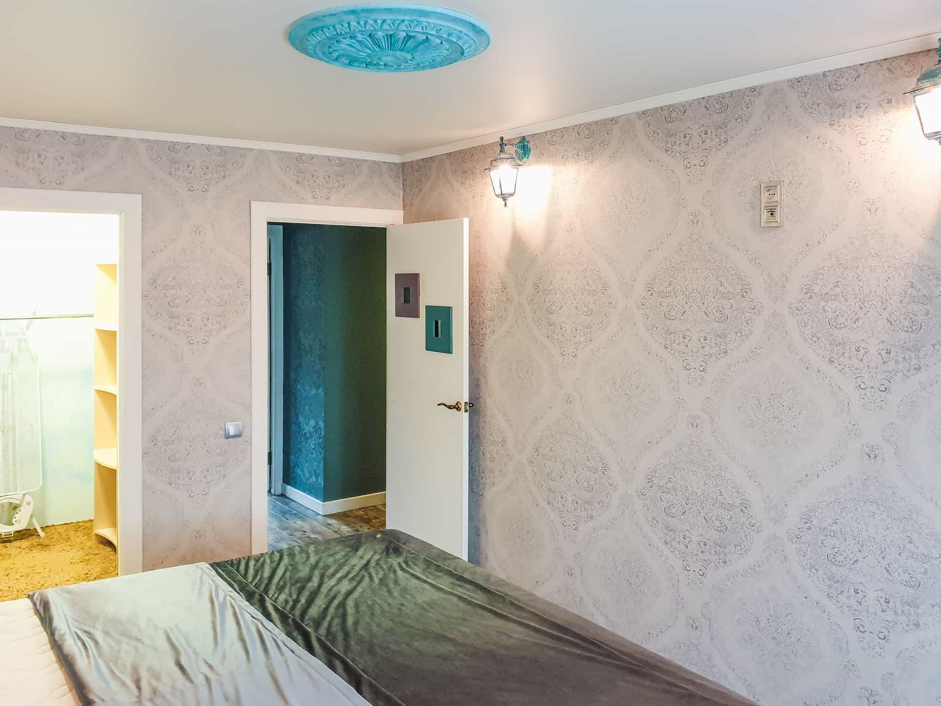 A compact ceiling fan in a small bedroom