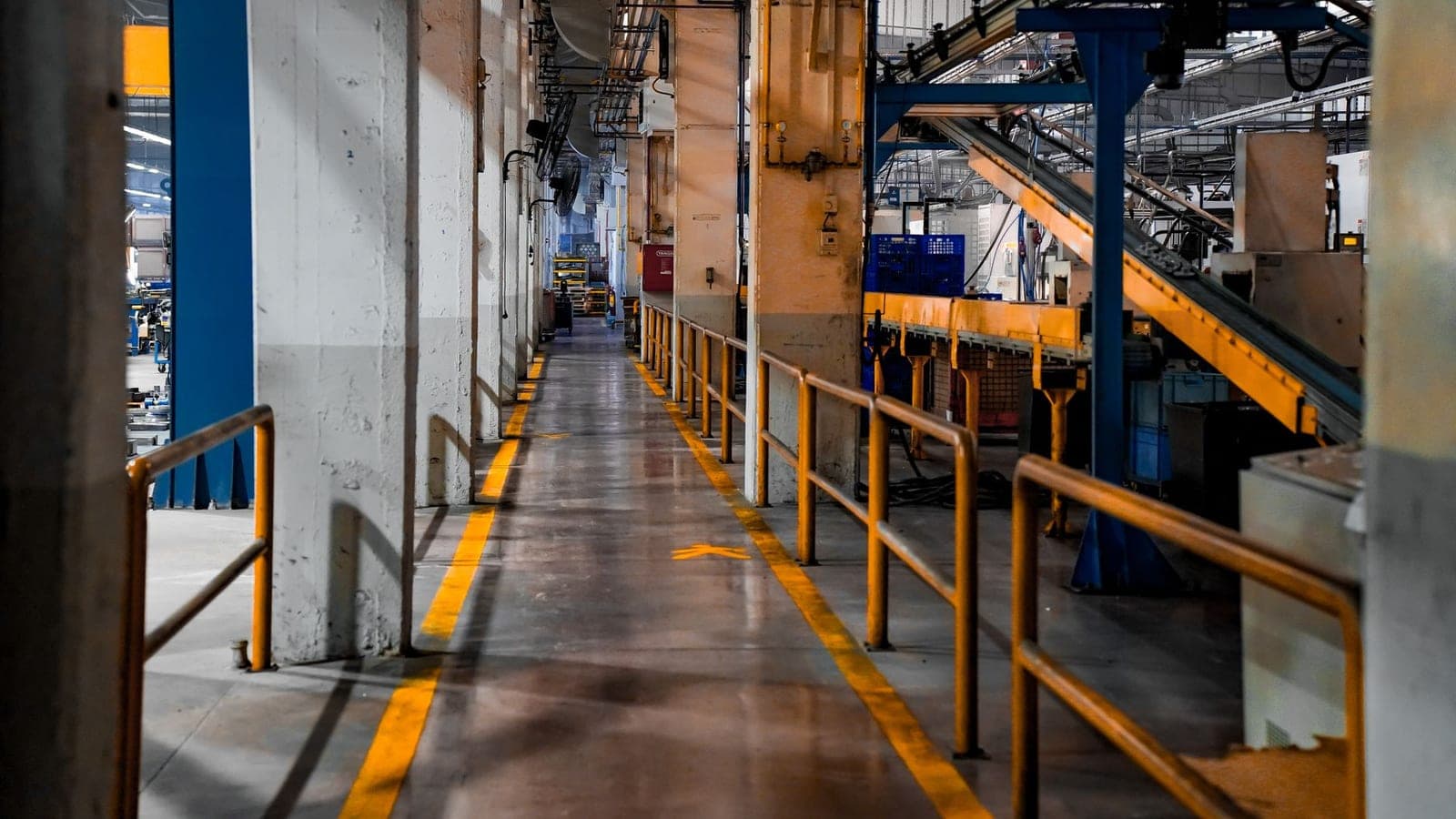 An industrial floor fan in a warehouse