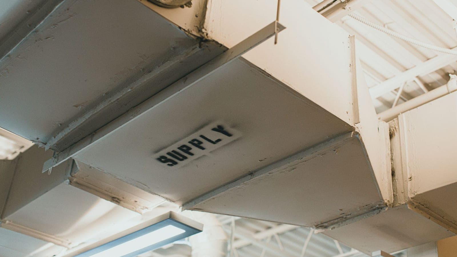 Metal ductwork running across a ceiling space