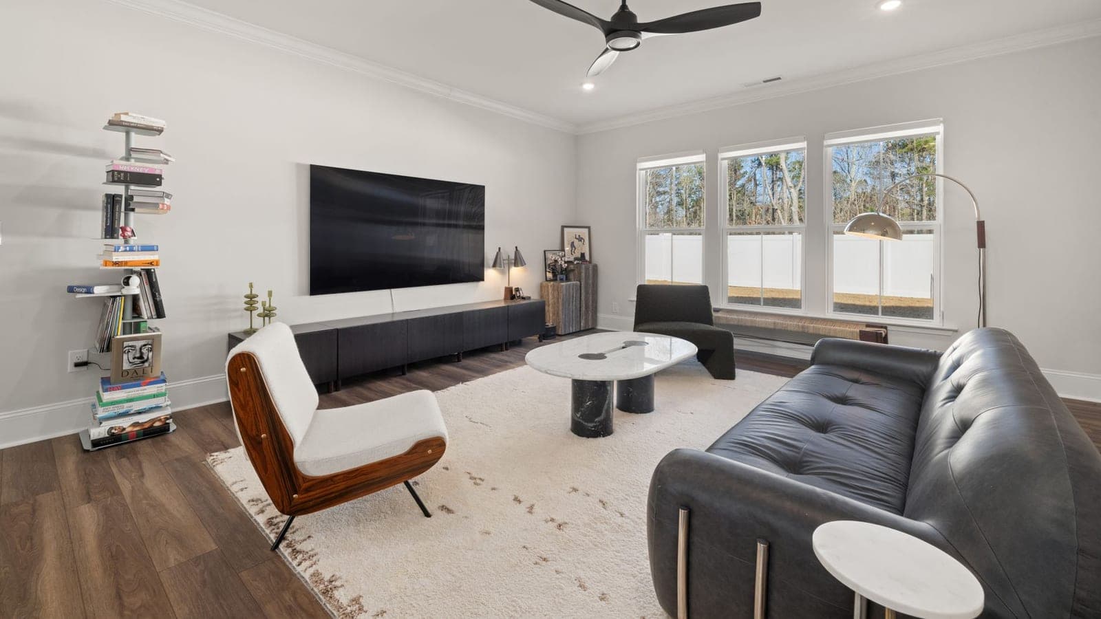 An oscillating tower fan in a living room