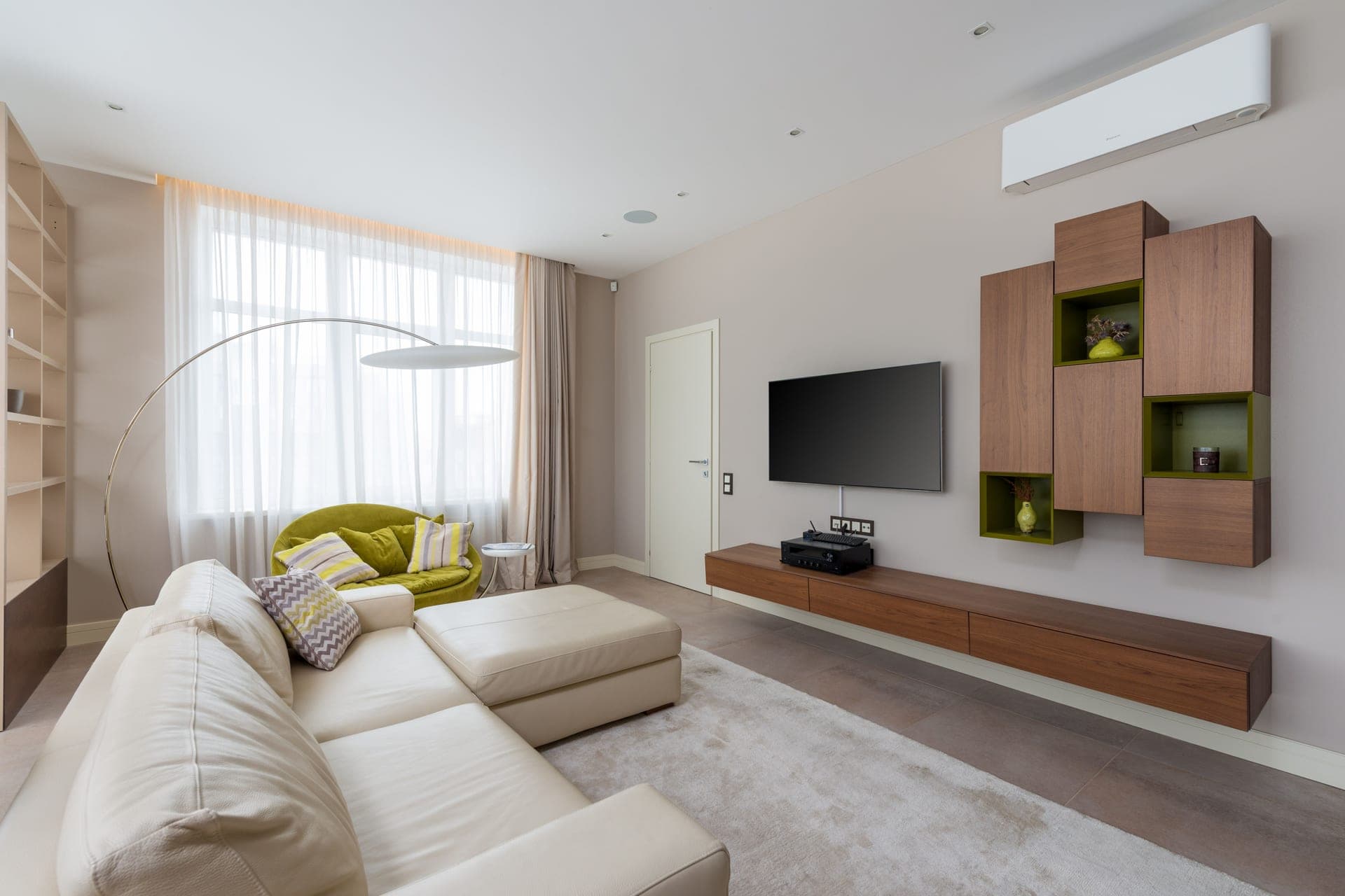 A living room with a large sofa in daylight