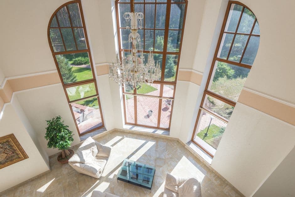 A spacious living area with floor-to-ceiling windows
