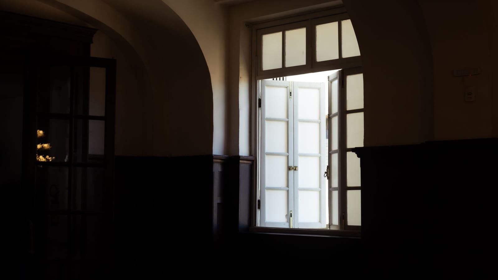 A casement window cranked open from inside a room