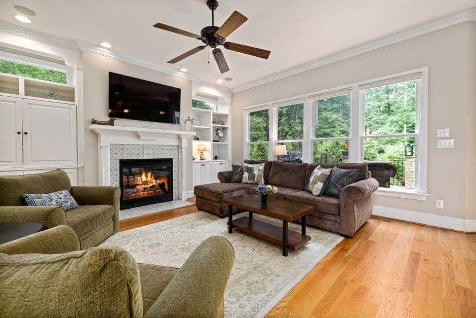 A well-designed living room with a fireplace and seating