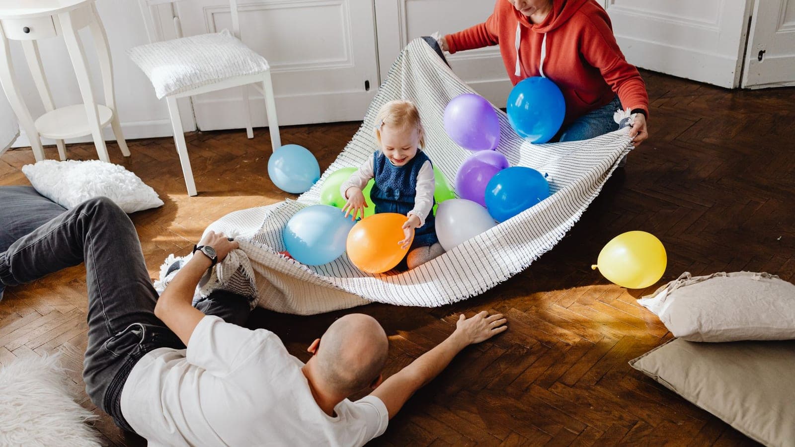 A toddler playing on a living room floor