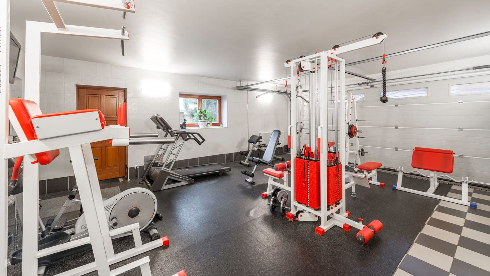 A home gym with weights and exercise equipment