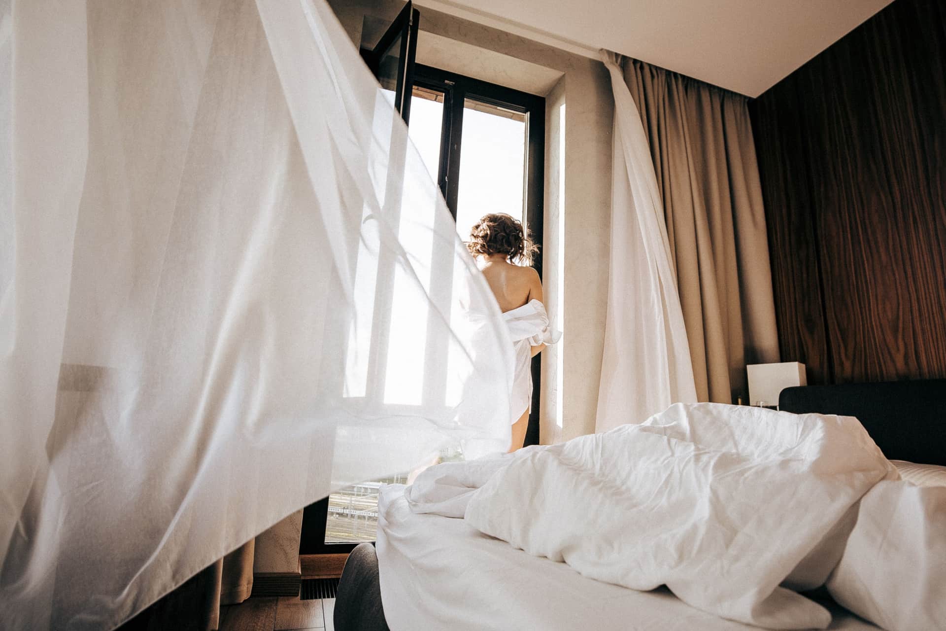 Curtains moving at an open window in daylight