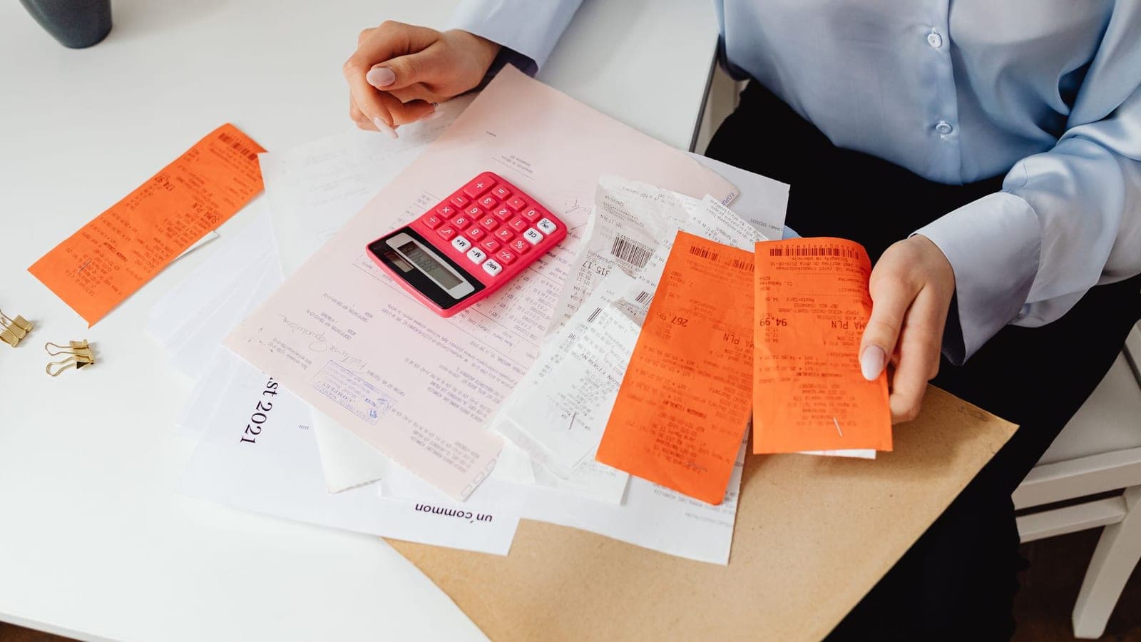 An electricity bill and a calculator on a desk