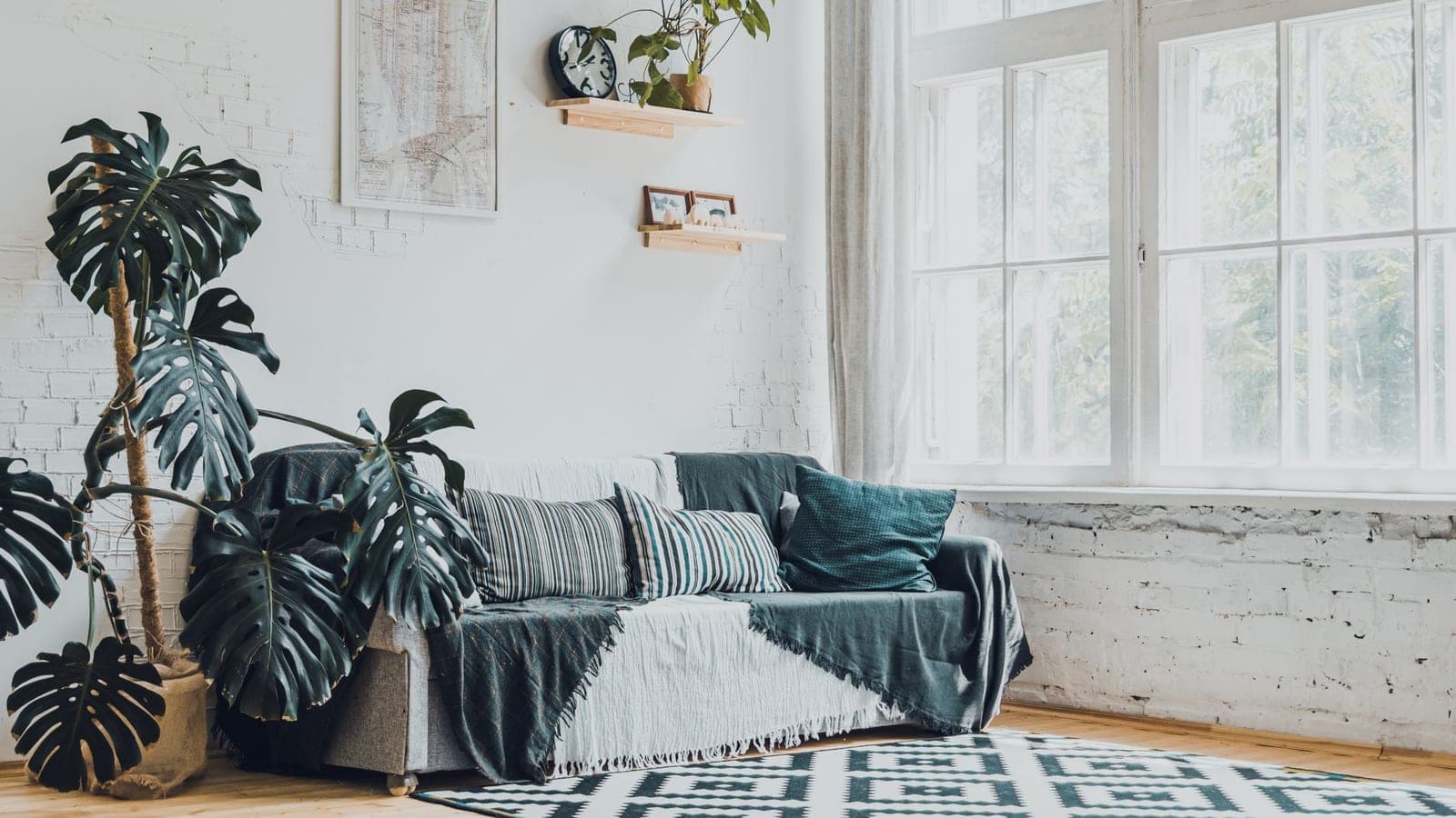 A bright living room with a sofa in summer