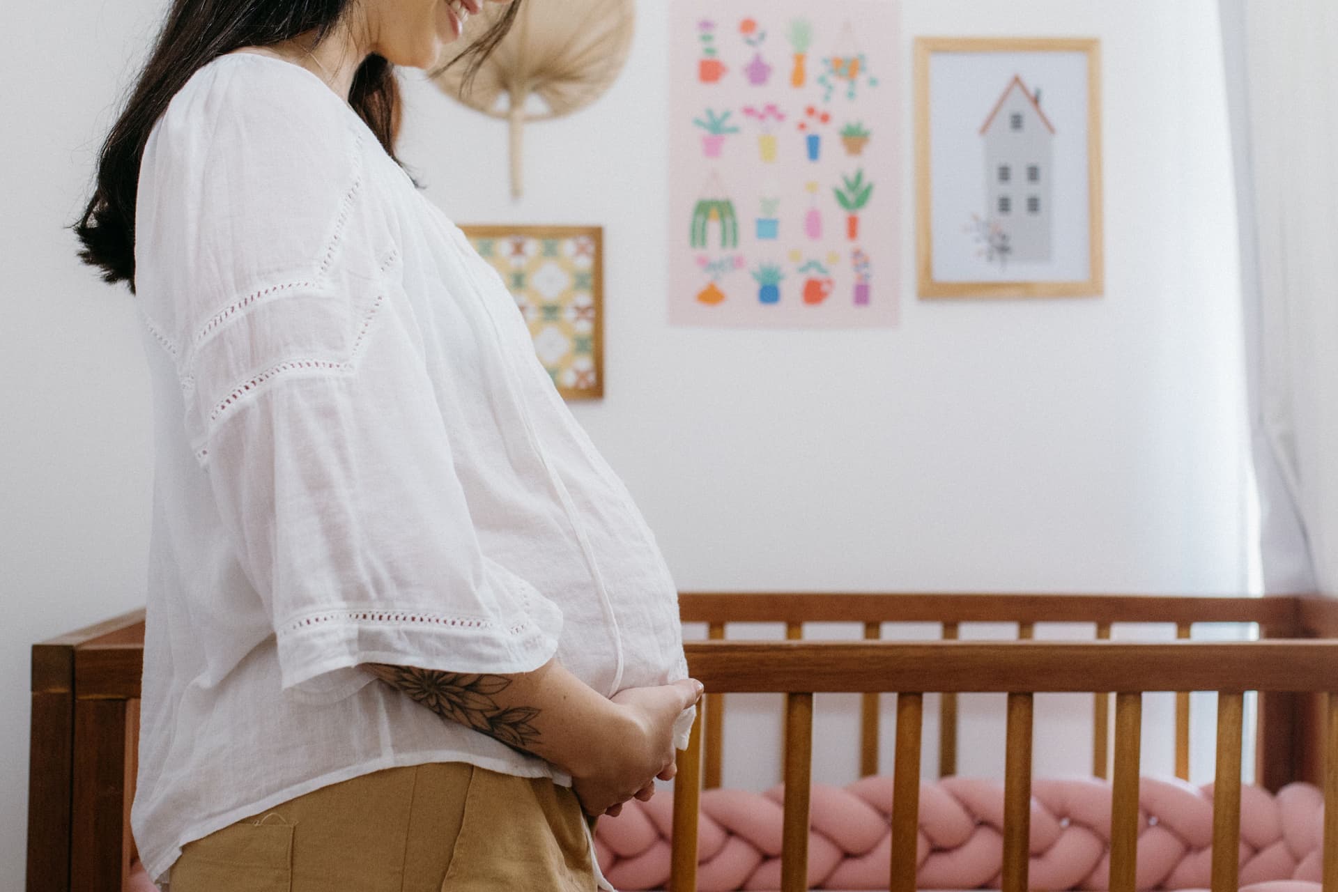 A quiet nursery with a cot and soft daylight
