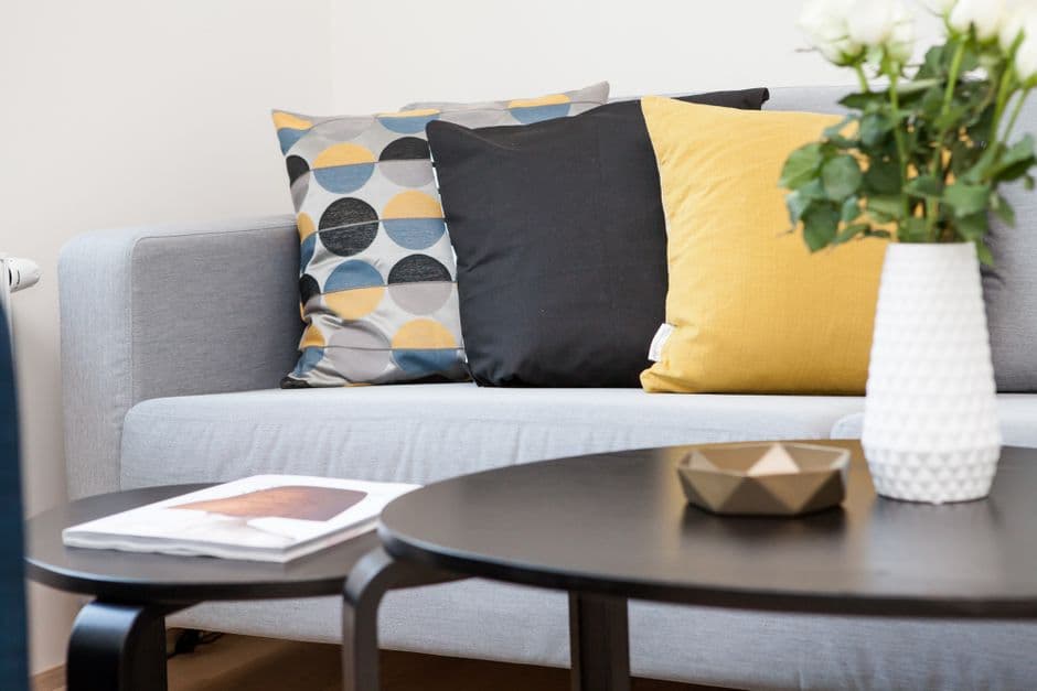 A contemporary rental living room with simple furnishings