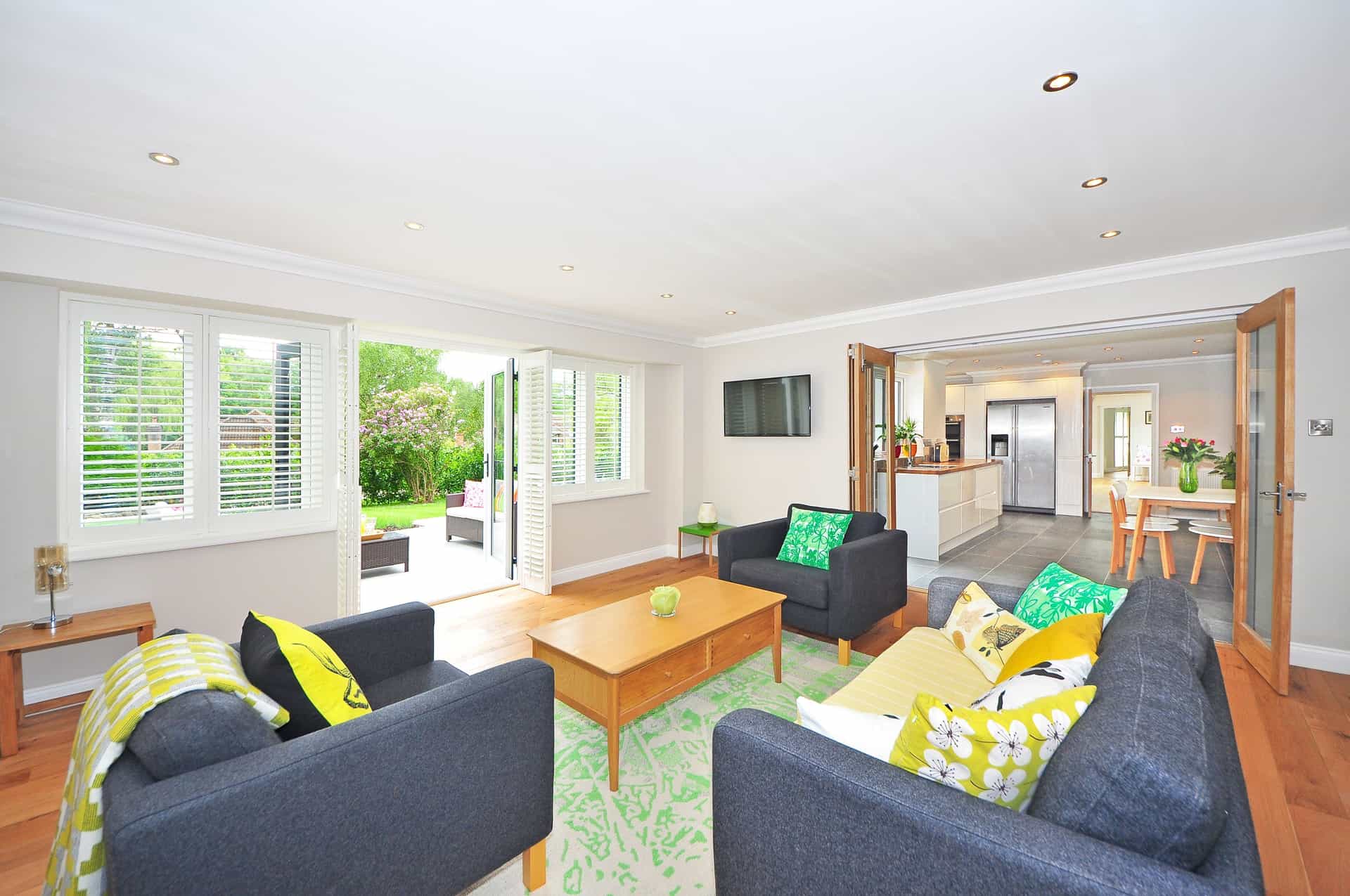 A light, airy living room in summer with sunlight across the floor