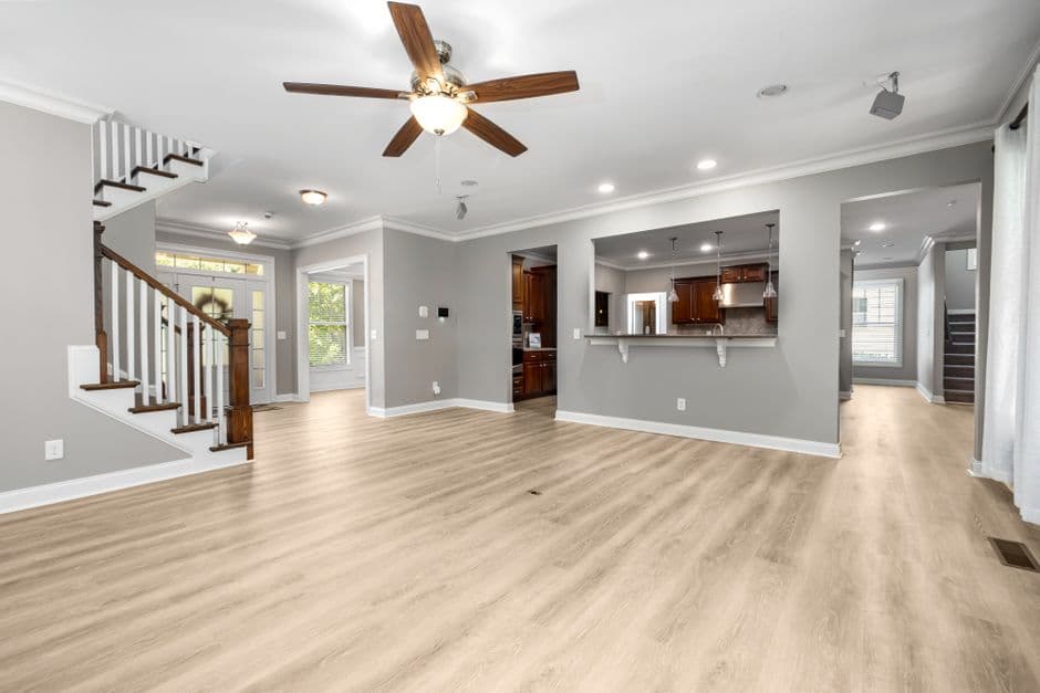 A modern open-plan living room with a high ceiling