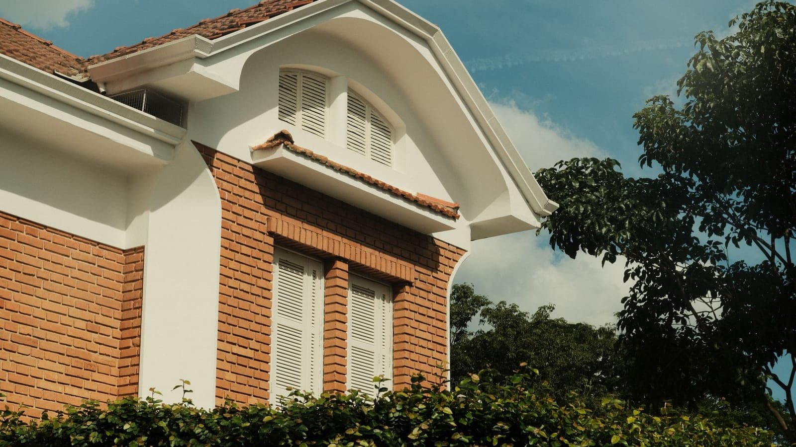A roof vent on a house exterior