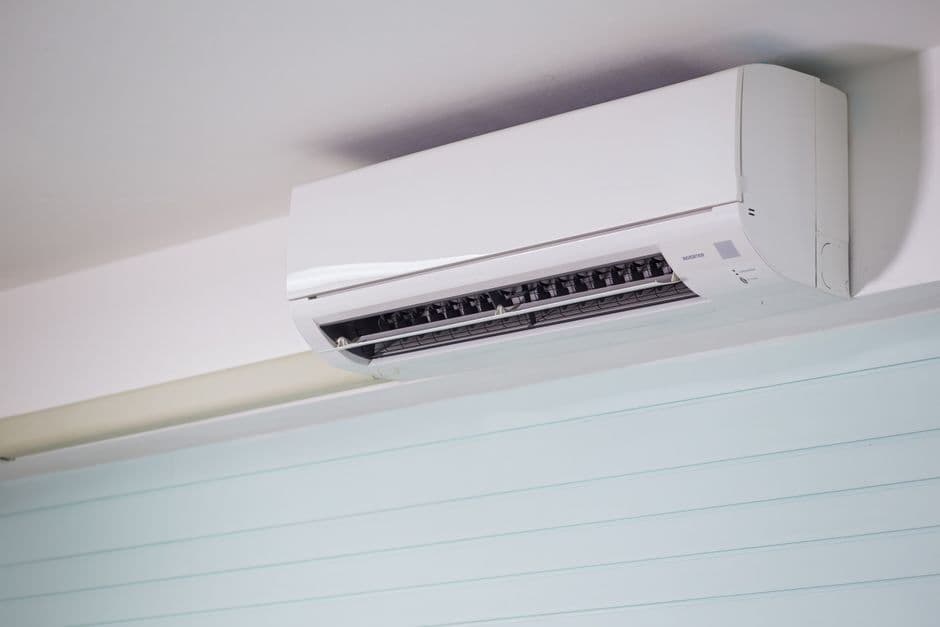 Close-up of a wall-mounted air conditioner indoors