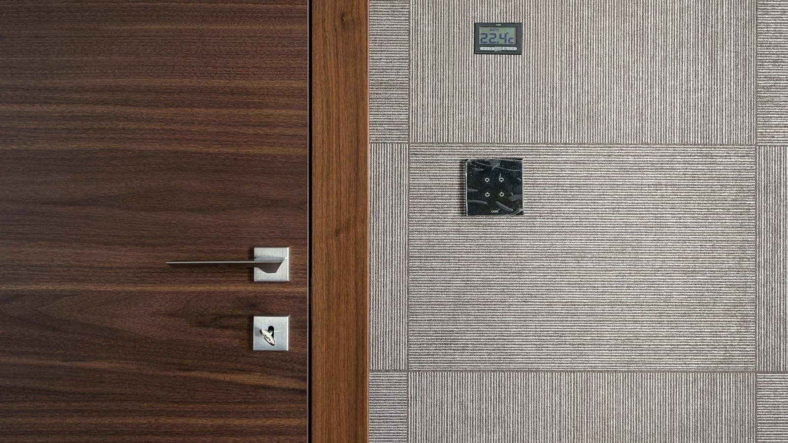 A wall thermostat in a warm room