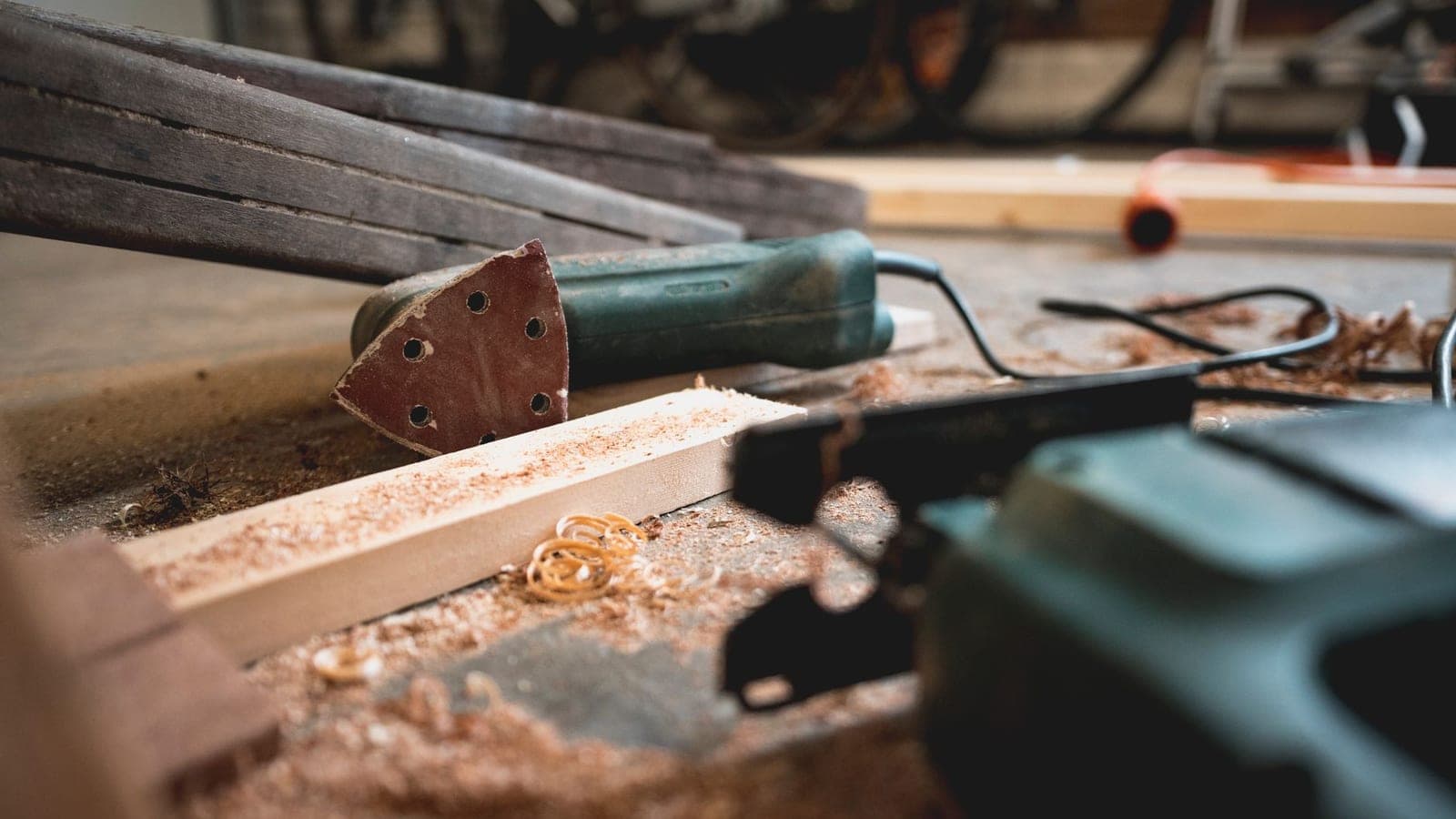 A woodworking workshop with tools and a bench